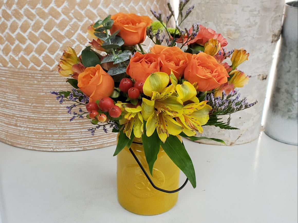 Fresh Flower Arrangement in Ceramic Container
