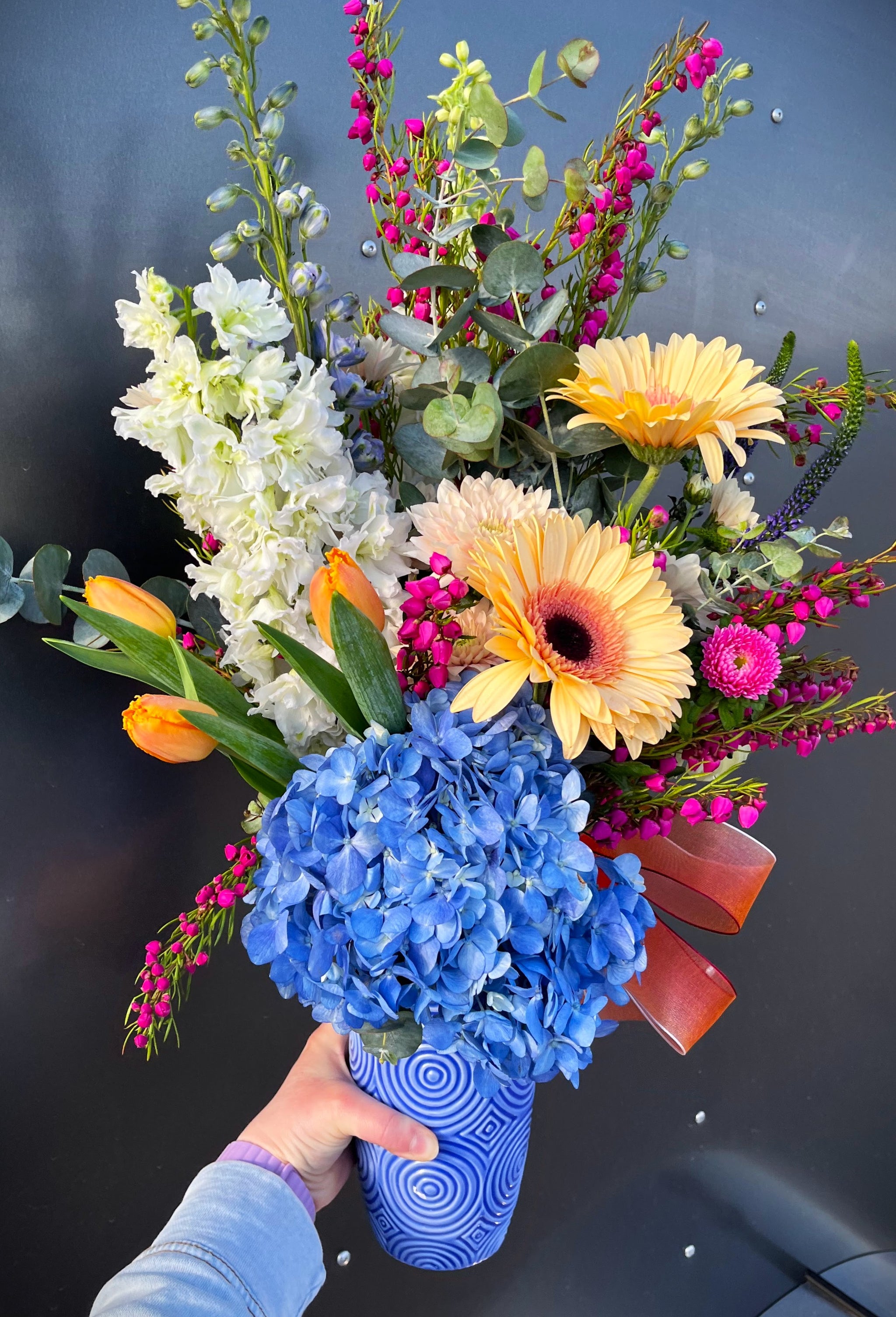 Fresh Flower Arrangement in Ceramic Container