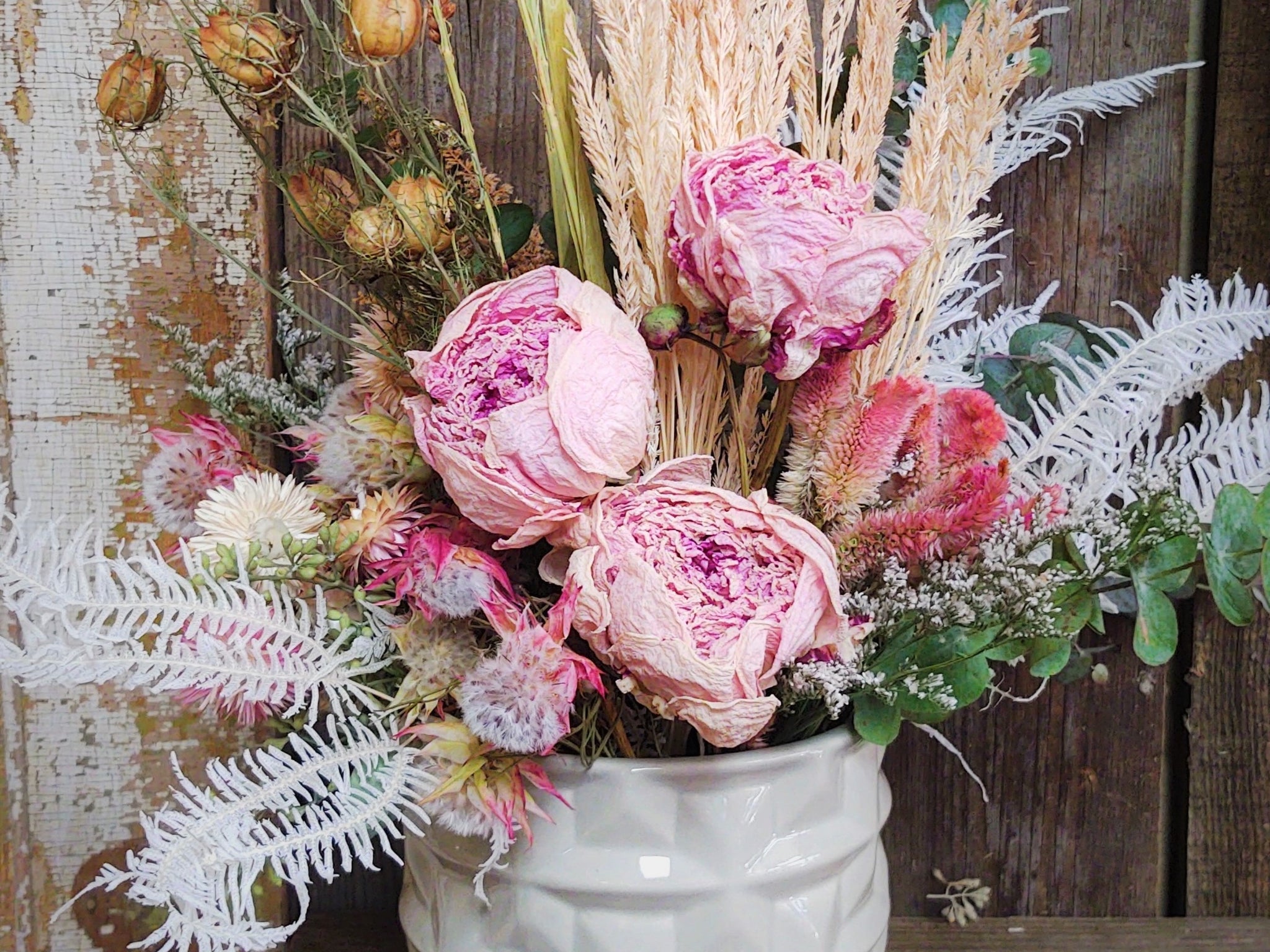 Beautiful Dried Hydrangeas In Big Transparent Glass Vase On Pink